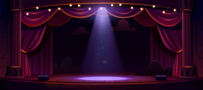 Dark theater stage with red curtains and spotlight